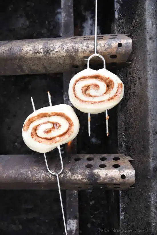 Campfire Cinnamon Rolls are cooked on a stick over a fire or grill. As easy as a can of biscuits, but with real yeast dough instead! The best cinnamon rolls you will ever have while camping!