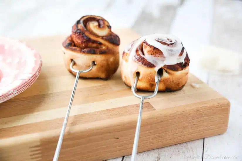 Campfire Cinnamon Rolls are cooked on a stick over a fire or grill. As easy as a can of biscuits, but with real yeast dough instead! The best cinnamon rolls you will ever have while camping!