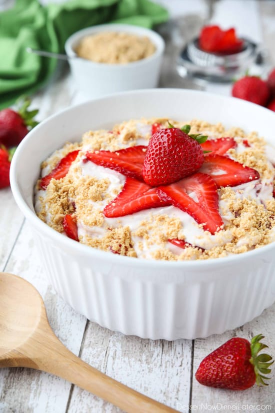 Strawberry Cheesecake Salad is loaded with cream cheese, jello pudding, yogurt, fresh strawberries, and whipped topping then sprinkled with a graham cracker crust. It's a delicious potluck salad, fluff salad, or decadent fruit salad that doubles as a dessert.