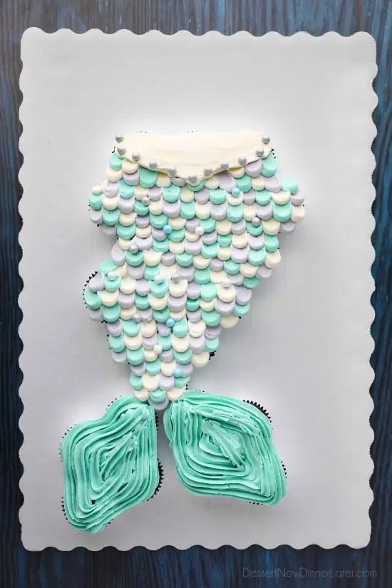 This Mermaid Tail Cupcake Cake is the perfect girls birthday cake, and this tutorial shows you exactly how to make it. Cupcakes pull apart for easy serving. (No cake to cut! Template included.)