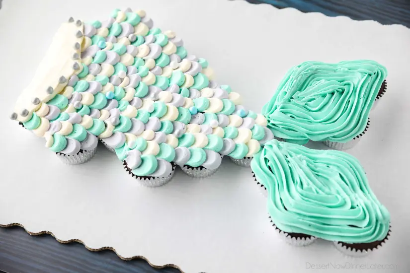 This Mermaid Tail Cupcake Cake is the perfect girls birthday cake, and this tutorial shows you exactly how to make it. Cupcakes pull apart for easy serving. (No cake to cut!)