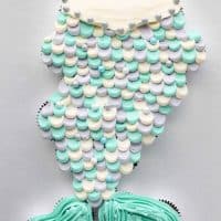 This Mermaid Tail Cupcake Cake is the perfect girls birthday cake, and this tutorial shows you exactly how to make it. Cupcakes pull apart for easy serving. (No cake to cut!) Plus extra mermaid birthday party ideas!
