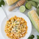 Mexican Street Corn Salad is easy, creamy, and packed with flavor! Your favorite roasted Mexican street corn (Elote) is cut off the cob (to make Esquites) and is served with a spoon, for a delicious summer side dish!