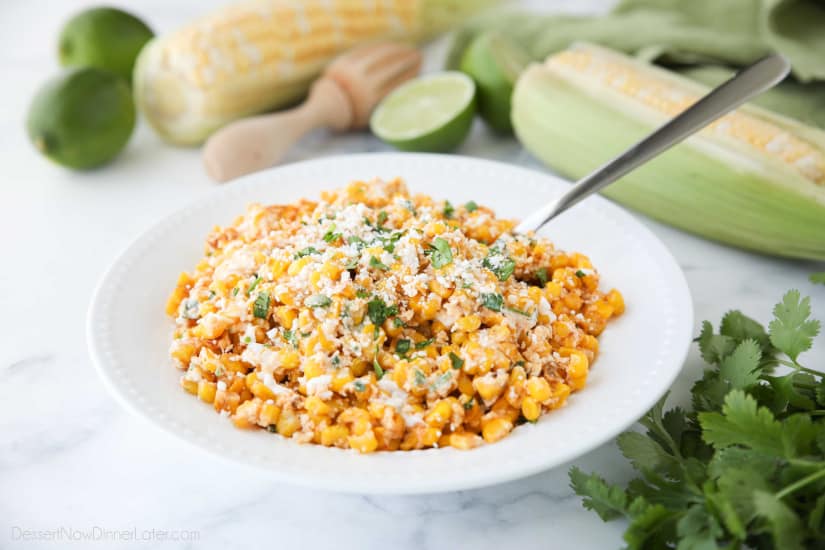 Mexican Street Corn Salad is easy, creamy, and packed with flavor! Your favorite roasted Mexican street corn (Elote) is cut off the cob (to make Esquites) and is served with a spoon, for a delicious summer side dish!