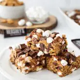 S'mores Krispie Treats have all the flavors of traditional s'mores made into an easy no-bake summer dessert. Loaded with Golden Grahams cereal, plenty of marshmallows and chocolate, these indoor s'mores bars are a crowd favorite.