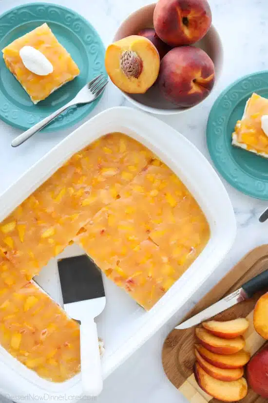 This Peaches and Cream Dessert has a pecan shortbread crust, no-bake cheesecake filling, and fresh peach layer on top. It's a delicious light and fruity summer dessert.