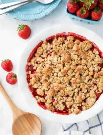 Strawberry Crisp (aka Strawberry Crumble) - Fresh, juicy strawberries are topped with a buttery brown sugar and oat crumb topping. Enjoy this summer dessert warm with a scoop of vanilla ice cream on top! ﻿