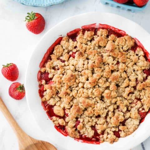 Strawberry Crisp (aka Strawberry Crumble) - Fresh, juicy strawberries are topped with a buttery brown sugar and oat crumb topping. Enjoy this summer dessert warm with a scoop of vanilla ice cream on top! ﻿