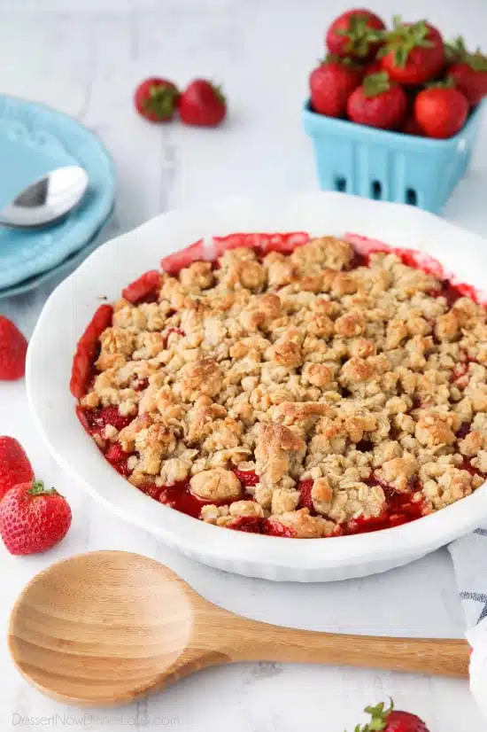 Strawberry Crisp (aka Strawberry Crumble) - Fresh, juicy strawberries are topped with a buttery brown sugar and oat crumb topping. Enjoy this summer dessert warm with a scoop of vanilla ice cream on top! 