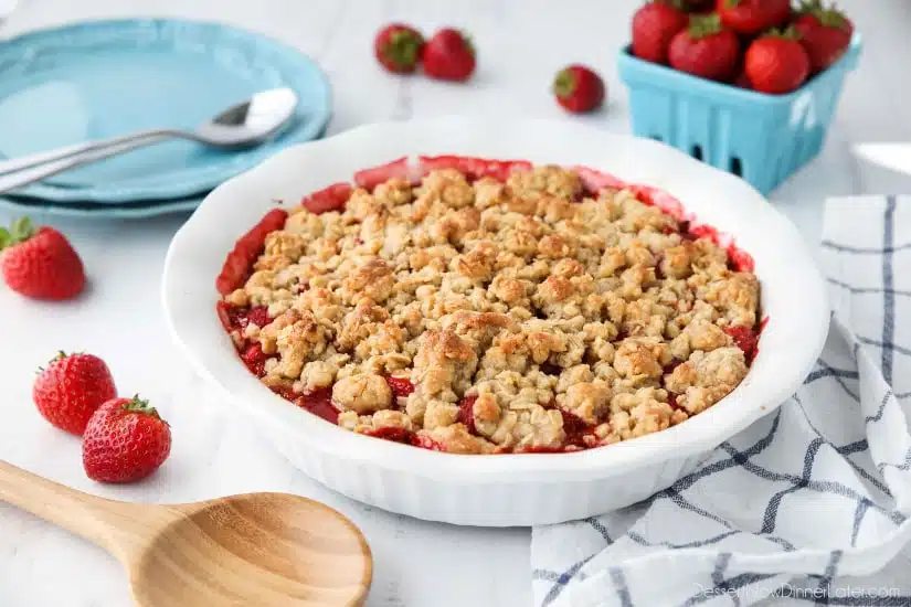 Strawberry Crisp (aka Strawberry Crumble) - Fresh, juicy strawberries are topped with a buttery brown sugar and oat crumb topping. Enjoy this summer dessert warm with a scoop of vanilla ice cream on top! 