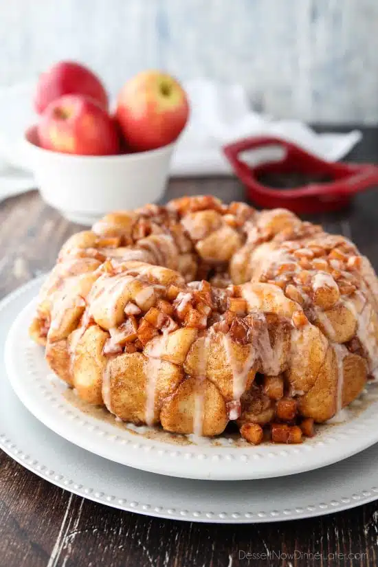 Apple Fritter Monkey Bread is an easy and delicious pull apart bread with chunks of caramelized apples, sticky cinnamon-sugar, and a light glaze. Fashioned after your favorite donut, this apple fritter bread makes a tasty breakfast or dessert.