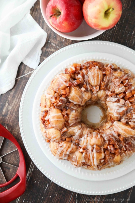 Apple Fritter Monkey Bread is an easy and delicious pull apart bread with chunks of caramelized apples, sticky cinnamon-sugar, and a light glaze. Fashioned after your favorite donut, this apple fritter bread makes a tasty breakfast or dessert.