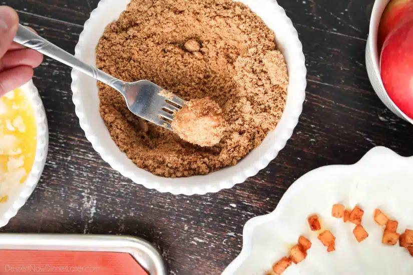 Apple Fritter Monkey Bread - Coating the dough pieces with cinnamon and brown sugar.