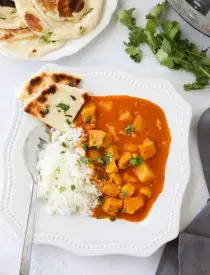 Instant Pot Indian Butter Chicken is quick, easy, creamy and flavorful. Chunks of chicken and potatoes are smothered in a mild tomato and coconut milk sauce that's filled with fragrant Indian spices. Serve it with some garlic naan for a restaurant quality dinner at home.