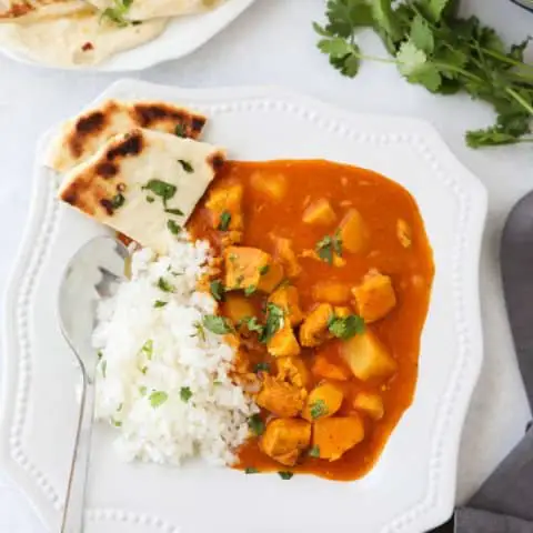 Instant Pot Indian Butter Chicken is quick, easy, creamy and flavorful. Chunks of chicken and potatoes are smothered in a mild tomato and coconut milk sauce that's filled with fragrant Indian spices. Serve it with some garlic naan for a restaurant quality dinner at home.