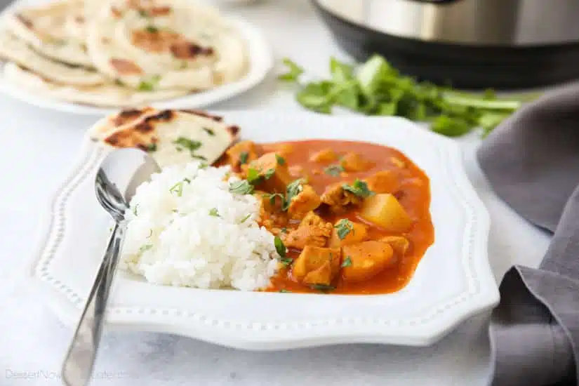 Instant Pot Indian Butter Chicken is quick, easy, creamy and flavorful. Chunks of chicken and potatoes are smothered in a mild tomato and coconut milk sauce that's filled with fragrant Indian spices. Serve it with some garlic naan for a restaurant quality dinner at home.