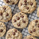These Oatmeal Chocolate Chip Cookies are thick, soft, and chewy, with plenty of hearty old fashioned oats and creamy chocolate chips. An easy classic recipe.