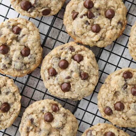These Oatmeal Chocolate Chip Cookies are thick, soft, and chewy, with plenty of hearty old fashioned oats and creamy chocolate chips. An easy classic recipe.