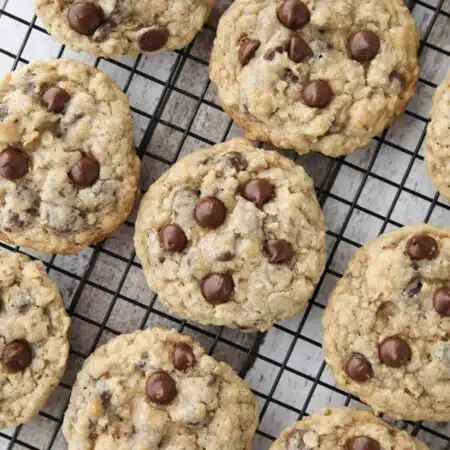 These Oatmeal Chocolate Chip Cookies are thick, soft, and chewy, with plenty of hearty old fashioned oats and creamy chocolate chips. An easy classic recipe.