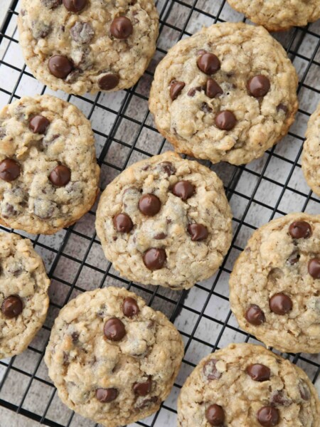 These Oatmeal Chocolate Chip Cookies are thick, soft, and chewy, with plenty of hearty old fashioned oats and creamy chocolate chips. An easy classic recipe.