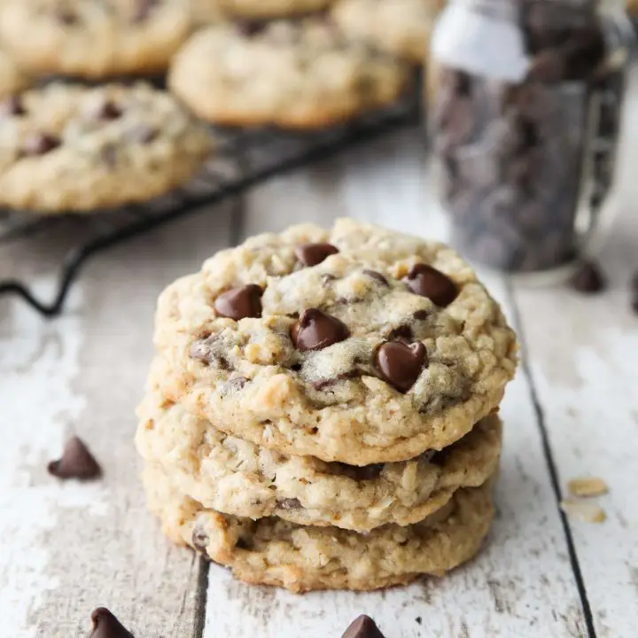 These Oatmeal Chocolate Chip Cookies are thick, soft, and chewy, with plenty of hearty old fashioned oats and creamy chocolate chips. An easy classic recipe.