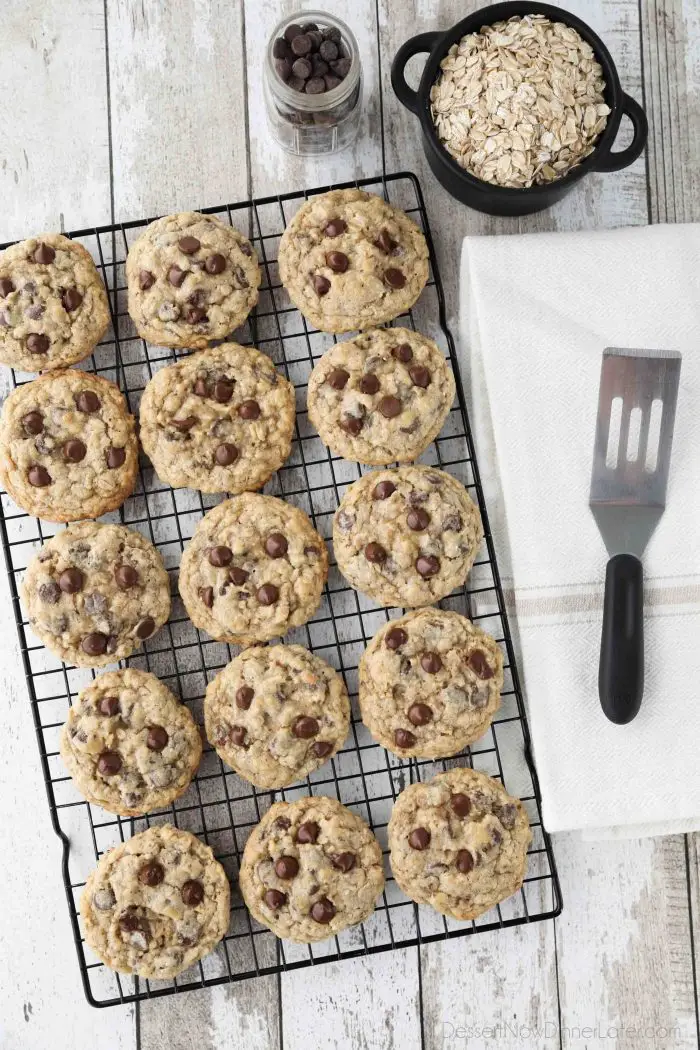 These Oatmeal Chocolate Chip Cookies are thick, soft, and chewy, with plenty of hearty old fashioned oats and creamy chocolate chips. An easy classic recipe.