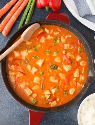 This Thai Red Curry with chicken and vegetables is easy, flavorful, and dinner ready in 30 minutes or less. It's healthier than takeout, and easy to make spicy or mild.