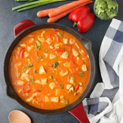 This Thai Red Curry with chicken and vegetables is easy, flavorful, and dinner ready in 30 minutes or less. It's healthier than takeout, and easy to make spicy or mild.