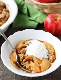 This is the best Apple Crisp recipe! It's full of fresh sliced apples, creates a fruity cinnamon-sugar sauce while it bakes (like apple pie filling), and is topped with a crunchy crumb topping. An easy, old fashioned fall dessert.