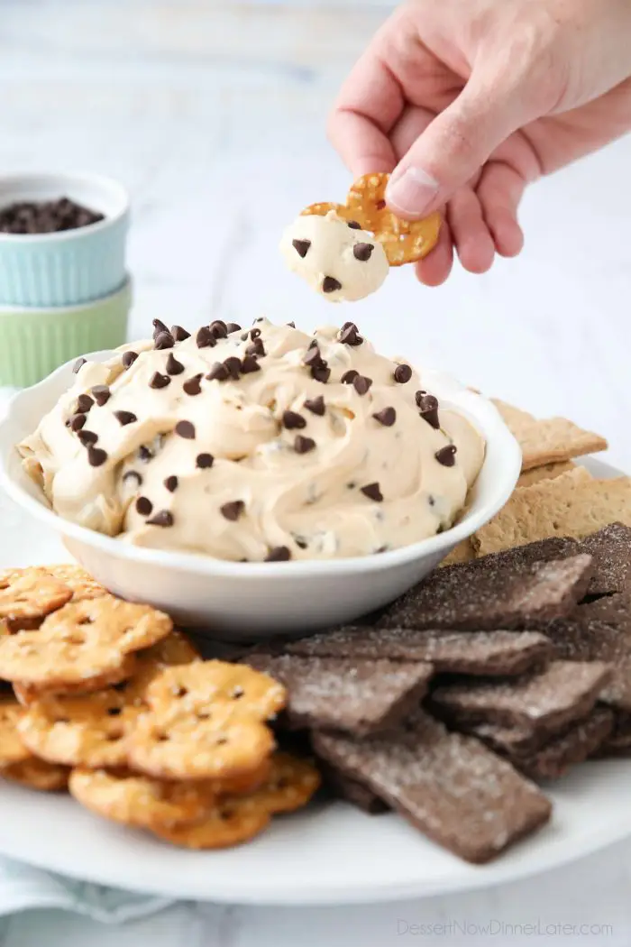 Peanut Butter Buckeye Dip served with pretzels and honey and chocolate graham crackers.