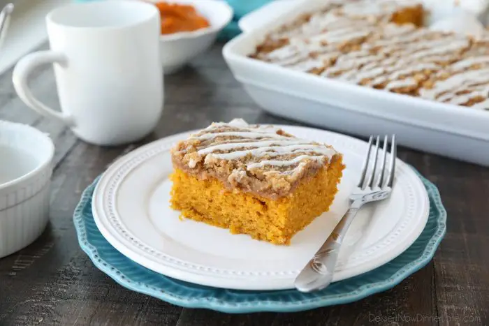 Pumpkin Spice Coffee Cake is easy to make and full of real pumpkin and fragrant spices. It's moist, yet light and fluffy, with a cinnamon crumb topping and pumpkin spice icing drizzle on top.