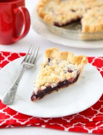 Cherry Crumb Pie can be made with fresh or frozen cherries, flavored with a hint of almond extract, and topped with a sweet crumble topping. Easy and delicious!