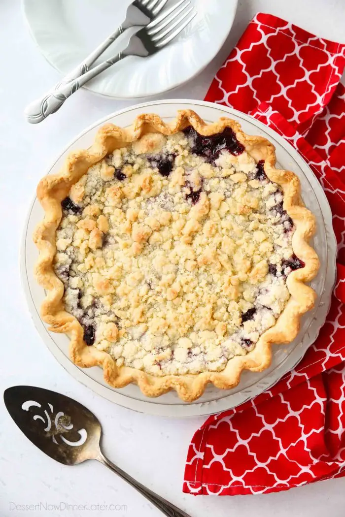 Cherry Crumb Pie can be made with fresh or frozen cherries, flavored with a hint of almond extract, and topped with a sweet crumble topping. Easy and delicious!