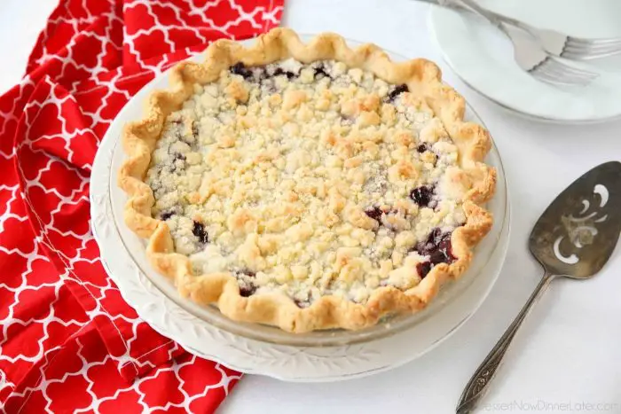 Cherry Crumb Pie can be made with fresh or frozen cherries, flavored with a hint of almond extract, and topped with a sweet crumble topping. Easy and delicious!