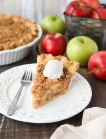 Dutch Apple Pie is made in a traditional pie crust, that's loaded with fresh cinnamon glazed apples, and topped with a sweet, buttery crumb streusel. It's like a combination of classic apple pie and apple crisp. A delicious holiday dessert.