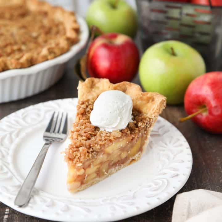 Dutch Apple Pie is made in a traditional pie crust, that's loaded with fresh cinnamon glazed apples, and topped with a sweet, buttery crumb streusel. It's like a combination of classic apple pie and apple crisp. A delicious holiday dessert.