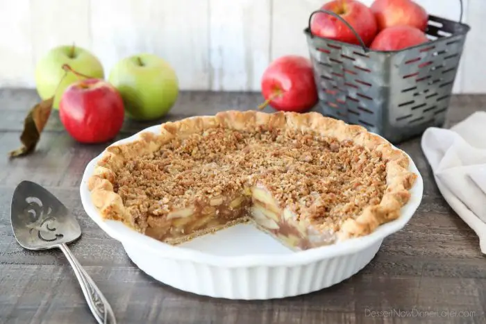 Dutch Apple Pie is made in a traditional pie crust, that's loaded with fresh cinnamon glazed apples, and topped with a sweet, buttery crumb streusel. It's like a combination of classic apple pie and apple crisp. A delicious holiday dessert.