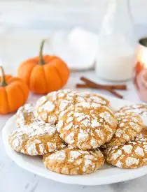 Pumpkin Crinkle Cookies are light, soft, and cake-like with warm, flavorful pumpkin spices. You'll love this easy fall cookie coated in powdered sugar that cracks as it bakes.