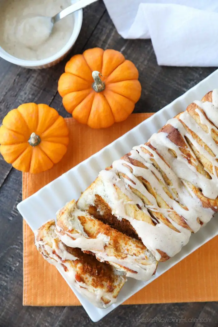 Pumpkin Pull Apart Bread is as delicious as sweet rolls, but super easy to make with layers of pumpkin, spices, and real store-bought yeast dough, not biscuits. Top it with a cream cheese glaze for a delicious seasonal breakfast or dessert.