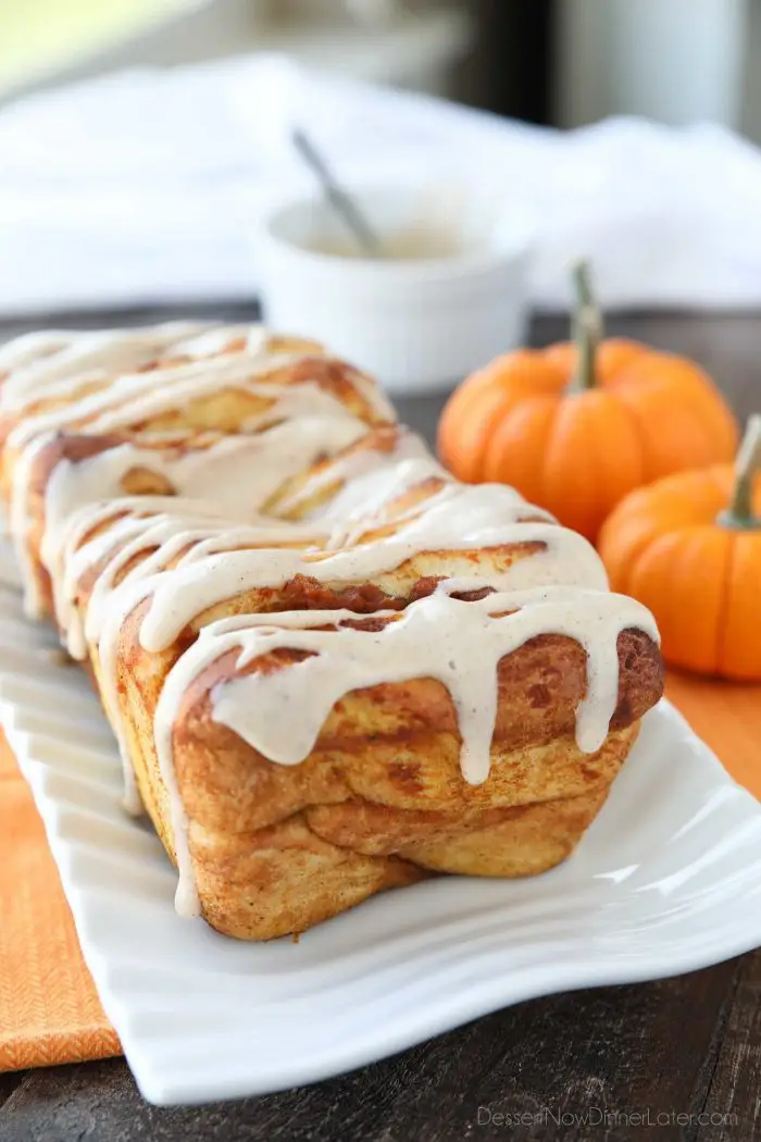 Pumpkin Pull Apart Bread is as delicious as sweet rolls, but super easy to make with layers of pumpkin, spices, and real store-bought yeast dough, not biscuits. Top it with a cream cheese glaze for a delicious seasonal breakfast or dessert.