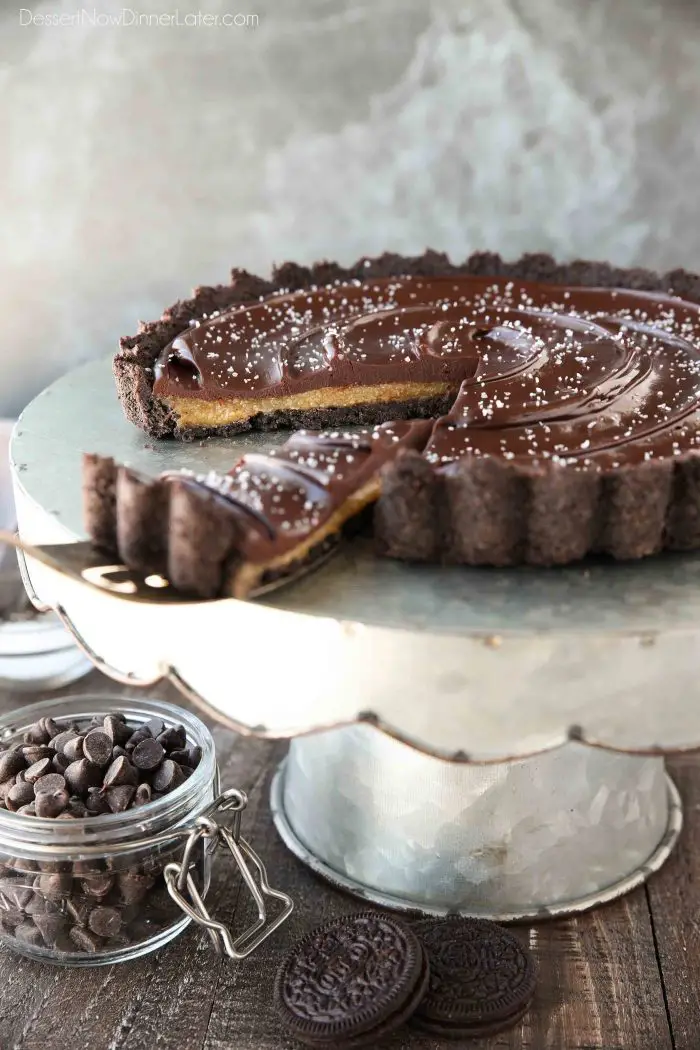 This easy Chocolate Caramel Tart has an Oreo cookie crust, soft caramel filling, and creamy chocolate ganache topped with flaky kosher salt. It's a rich and satisfying chocolate dessert that looks fancy, but is easy to make.