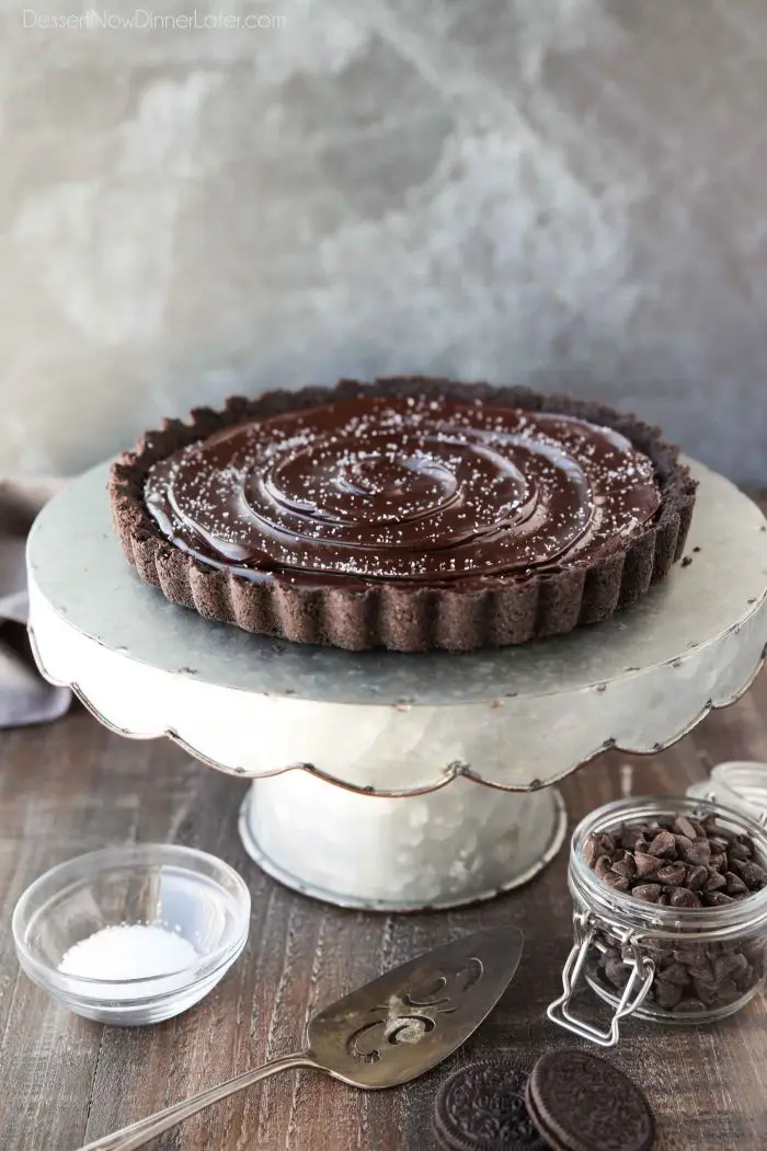 A chocolate lover's dream! This easy Chocolate Caramel Tart has an Oreo cookie crust, soft caramel filling, and creamy chocolate ganache topped with flaky kosher salt.