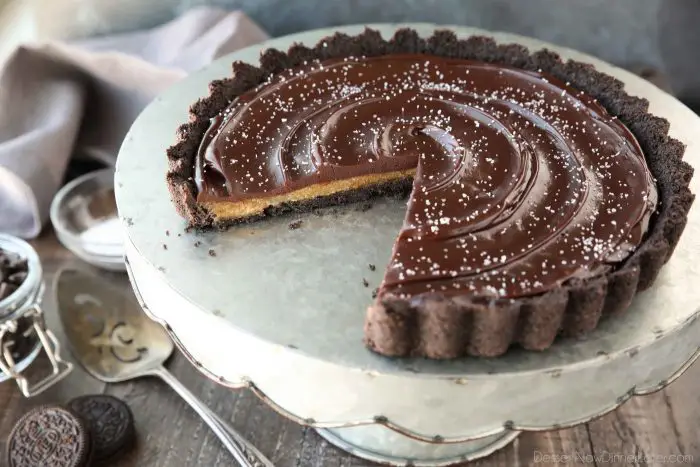 This easy Chocolate Caramel Tart has an Oreo cookie crust, soft caramel filling, and creamy chocolate ganache topped with flaky kosher salt. It's a rich and satisfying chocolate dessert that looks fancy, but is easy to make.