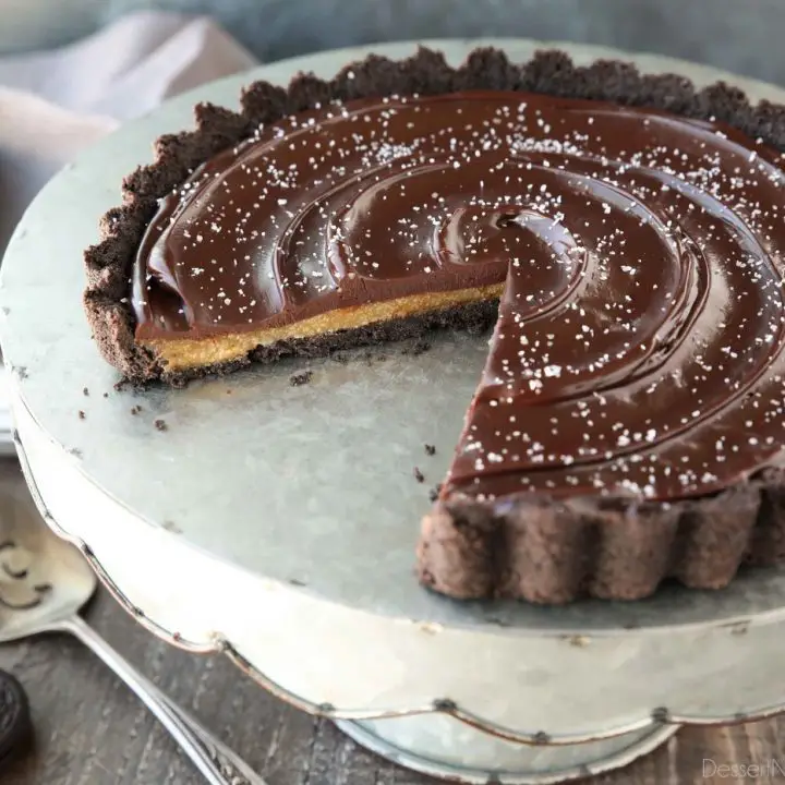 This easy Chocolate Caramel Tart has an Oreo cookie crust, soft caramel filling, and creamy chocolate ganache topped with flaky kosher salt. It's a rich and satisfying chocolate dessert that looks fancy, but is easy to make.