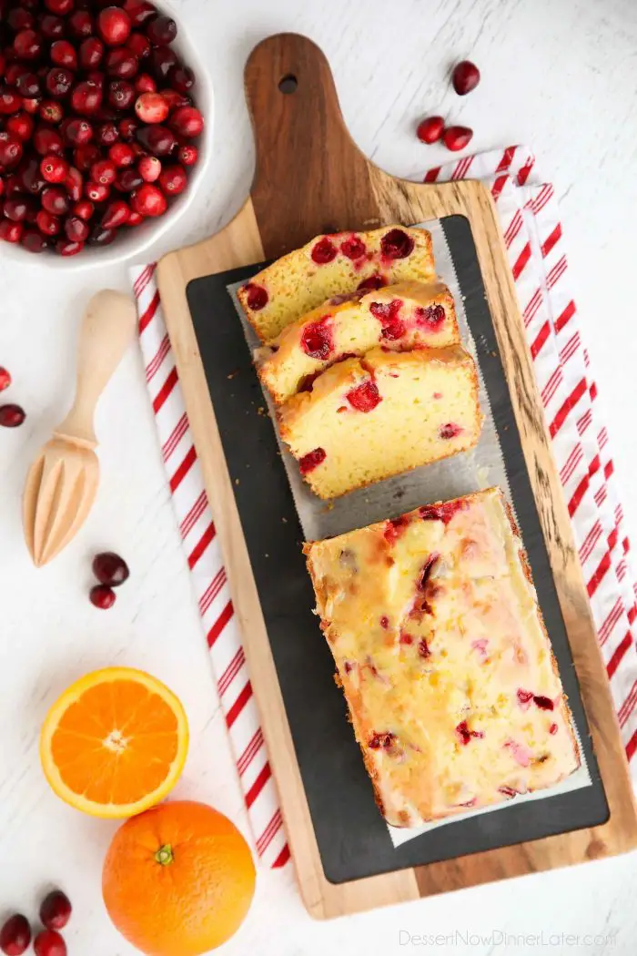 Cranberry Orange Bread is a wonderful treat for the holidays, with a sweet orange glaze on top and pops of tart cranberries throughout. Great for Christmas breakfast or a neighbor gift.