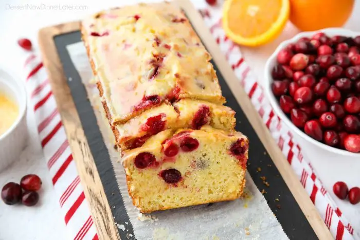 Cranberry Orange Bread is a wonderful treat for the holidays, with a sweet orange glaze on top and pops of tart cranberries throughout.