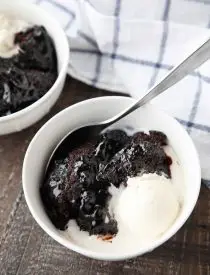 Hot Fudge Pudding Cake is easy to make and magically bakes chocolate cake with a hot fudge pudding sauce in the same pan. It's gooey, chocolatey, and delicious! Serve it warm with ice cream for an even tastier dessert!