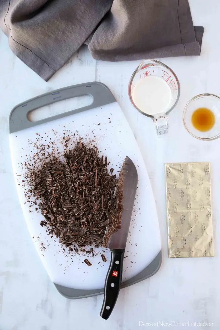 Finely chopped chocolate, heavy cream, and vanilla for homemade chocolate truffles.
