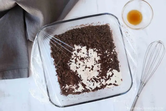 Hot cream melts the finely chopped chocolate.