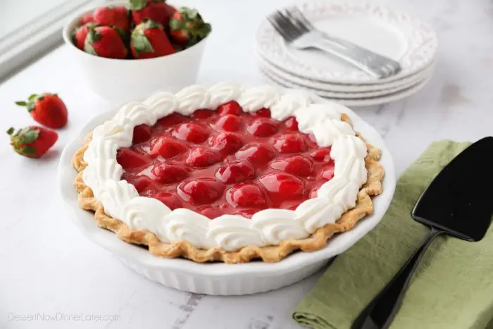 Strawberry Cream Pie is light, fruity, and delicious. With layers of pie crust, no-bake cheesecake, and slices of fresh strawberries smothered in a sweet glaze.